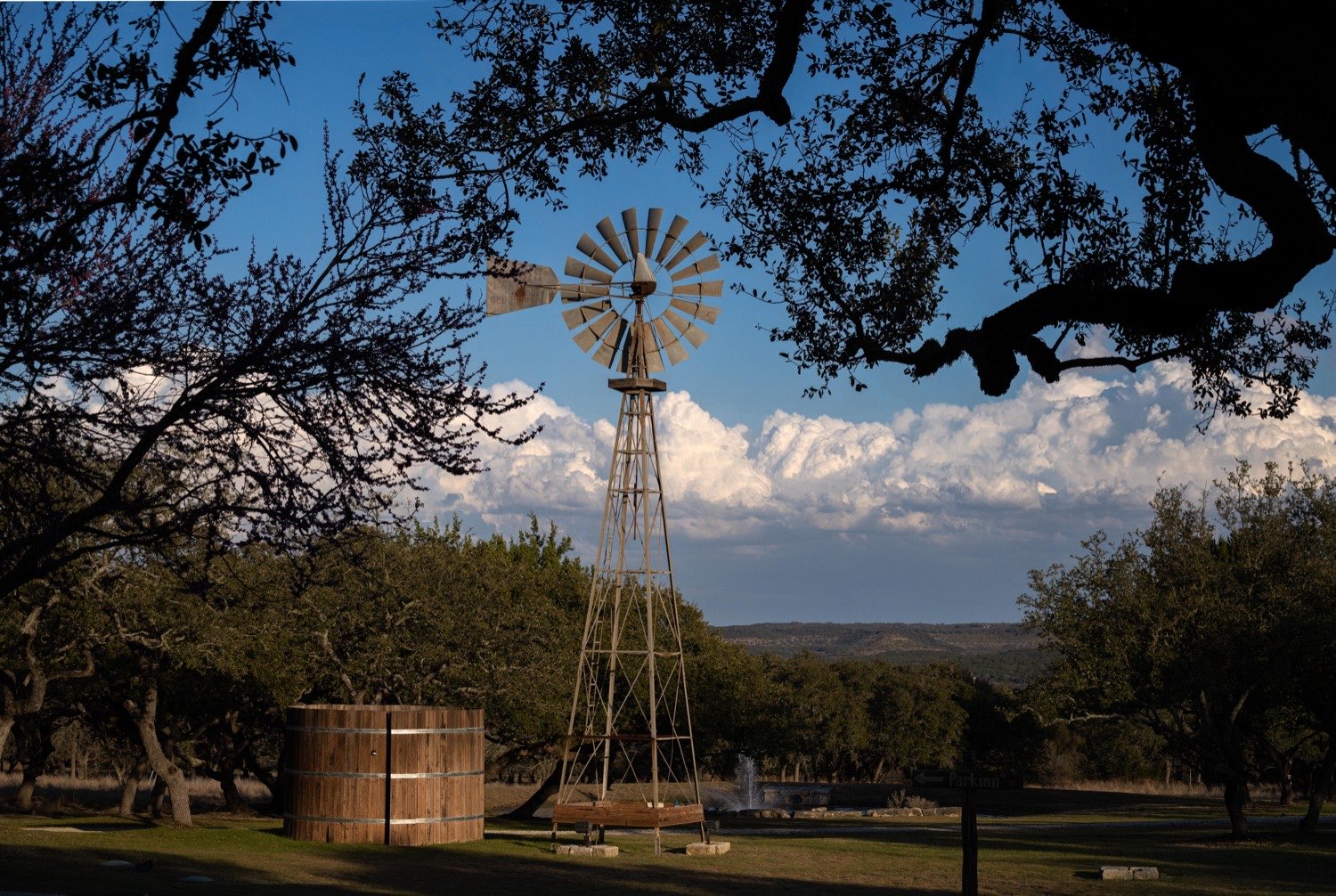 The windmill over the open field at Wimberley Valley Lodge