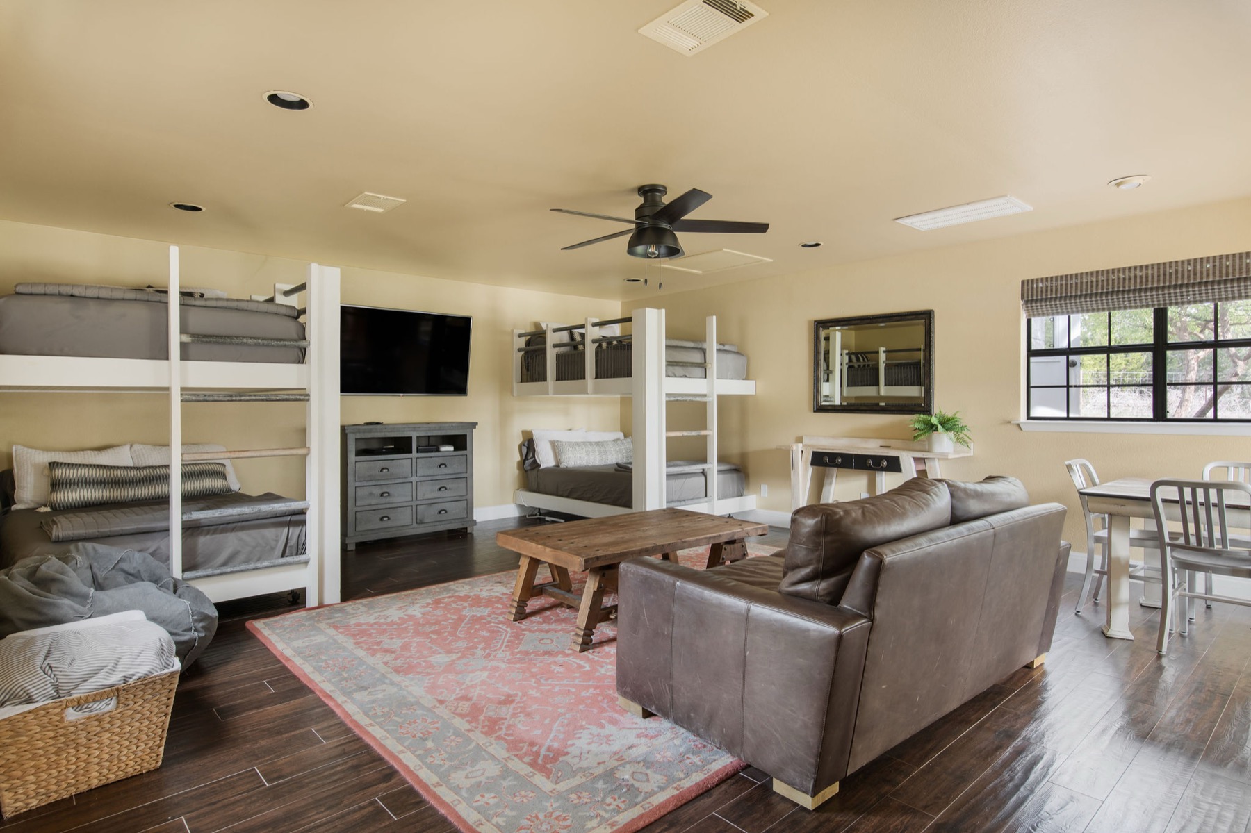 The bunkhouse common room — bunks and a living area for the whole crew